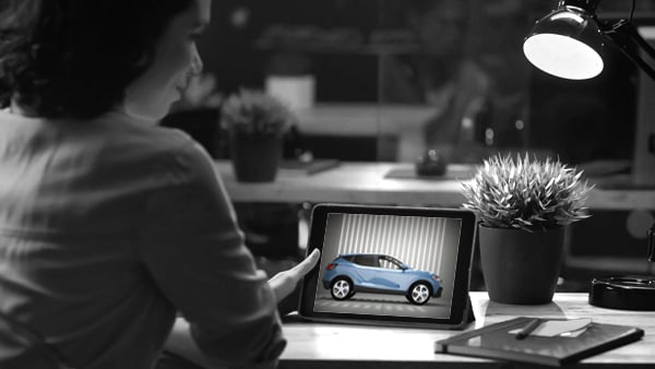 Women looking at vehicle on tablet