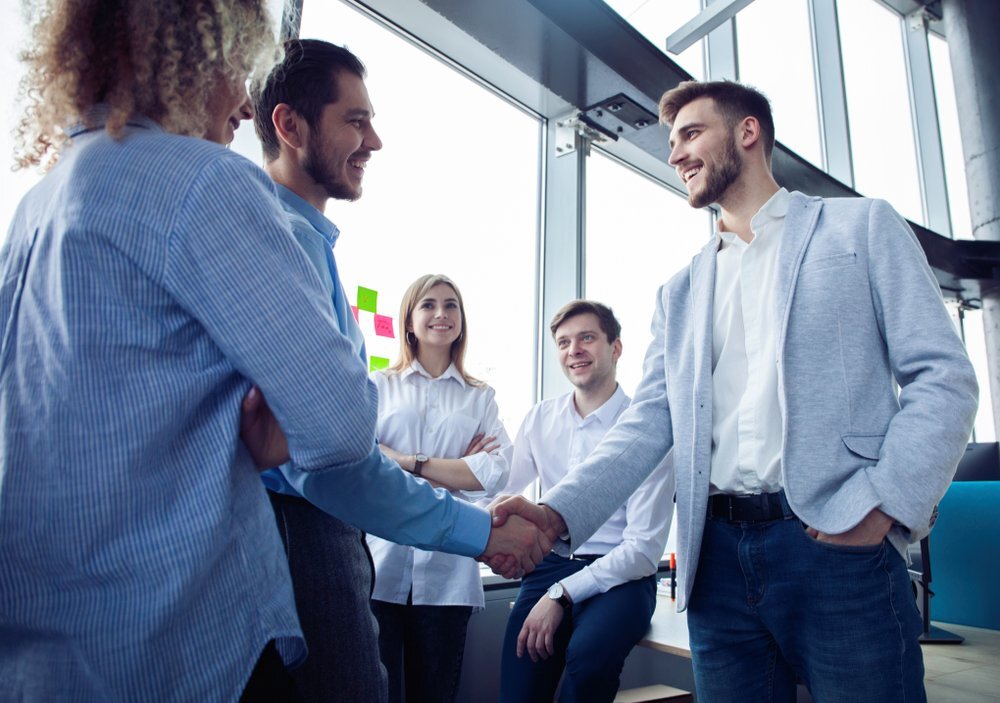 two business men shaking hands on agreement