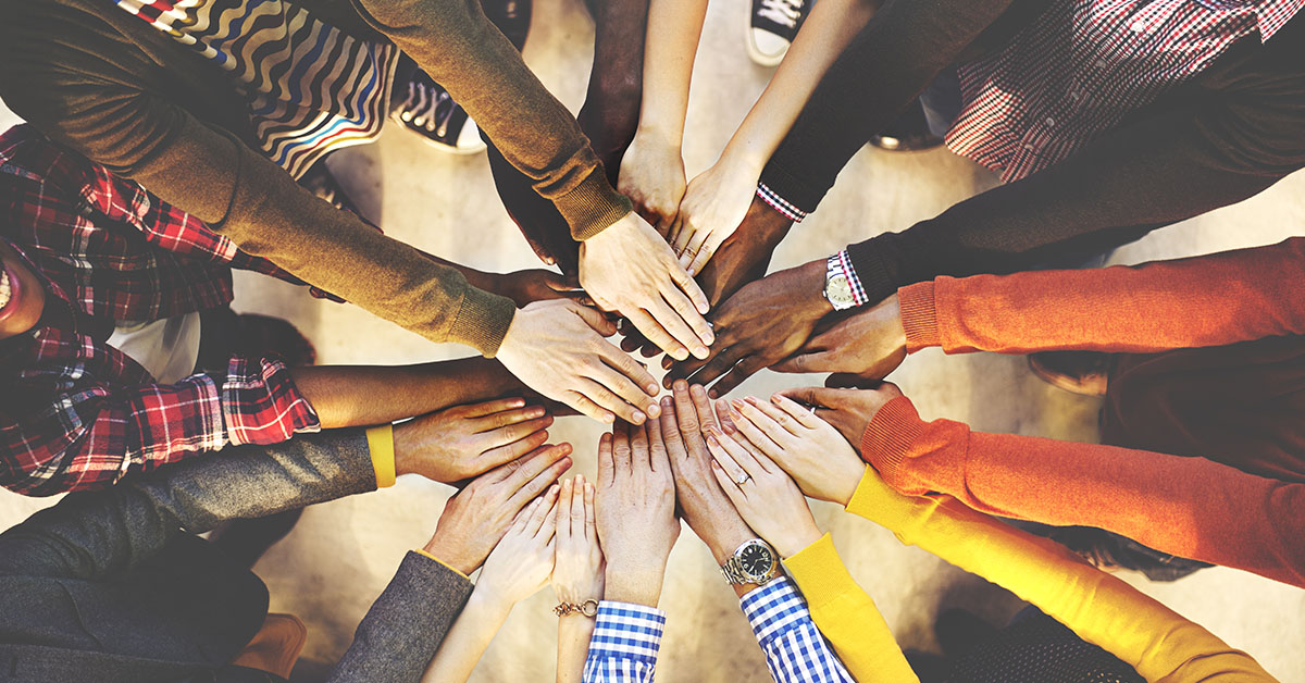 Hands in a circle showing teamwork